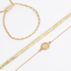 Set of 3 lurex ribbon braid bracelets and golden solar pendants